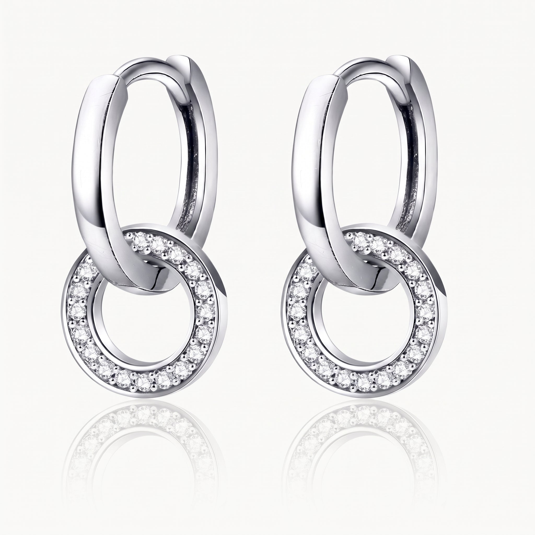 Silver-tone interlocking hoop earrings with a crystal-set ring