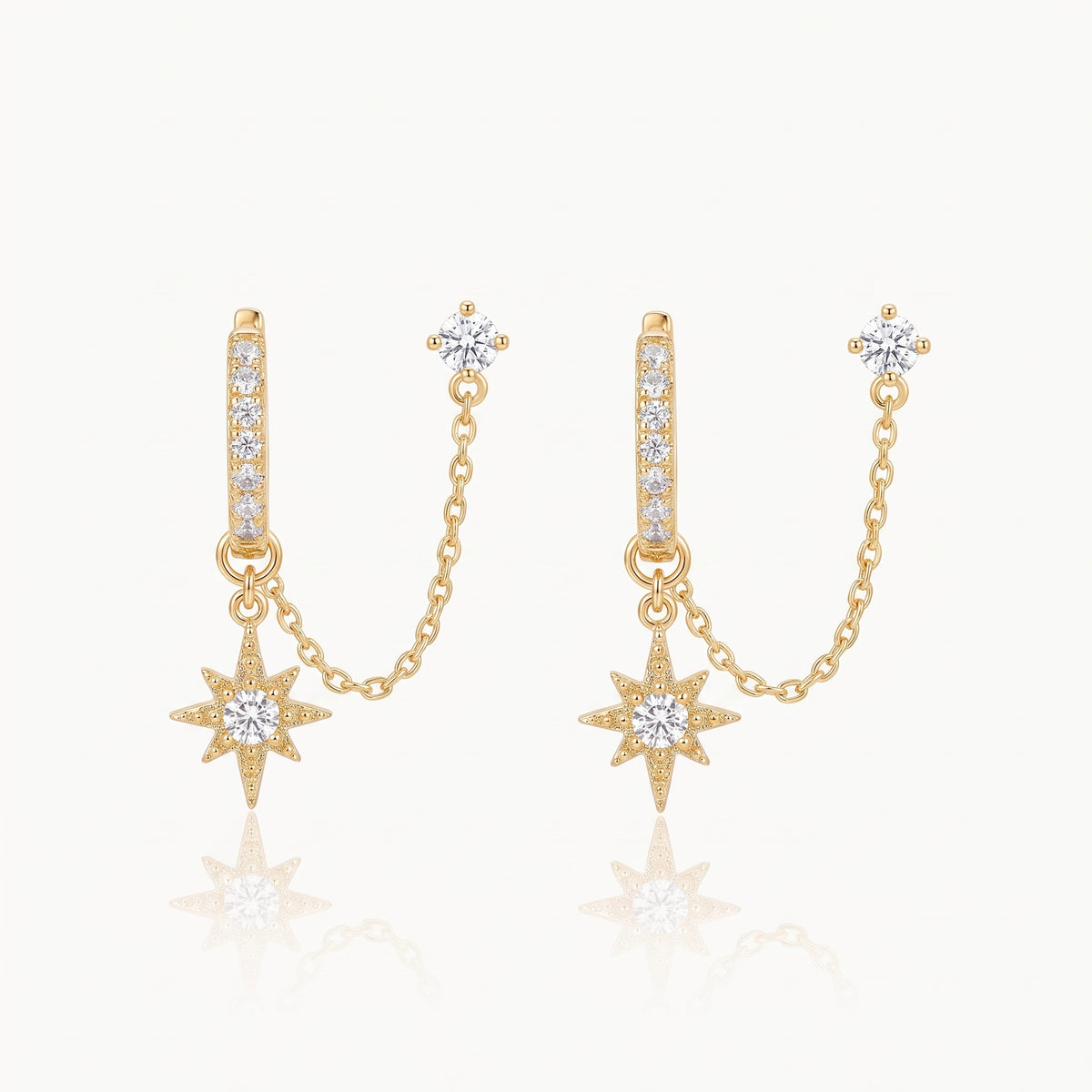 Gold-tone chained huggie earrings with crystal stud