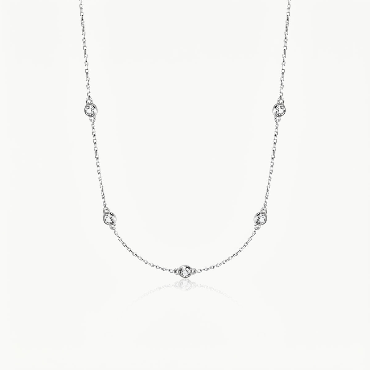 Silver-tone crystal necklace with five stones on a fine chain