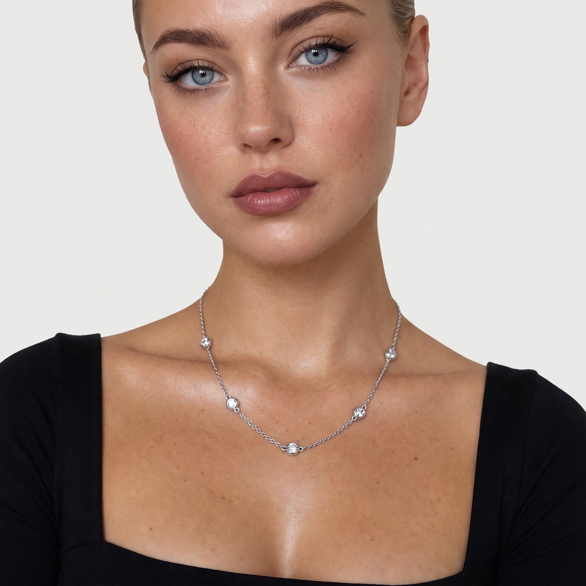 Model wearing the silver-tone crystal necklace