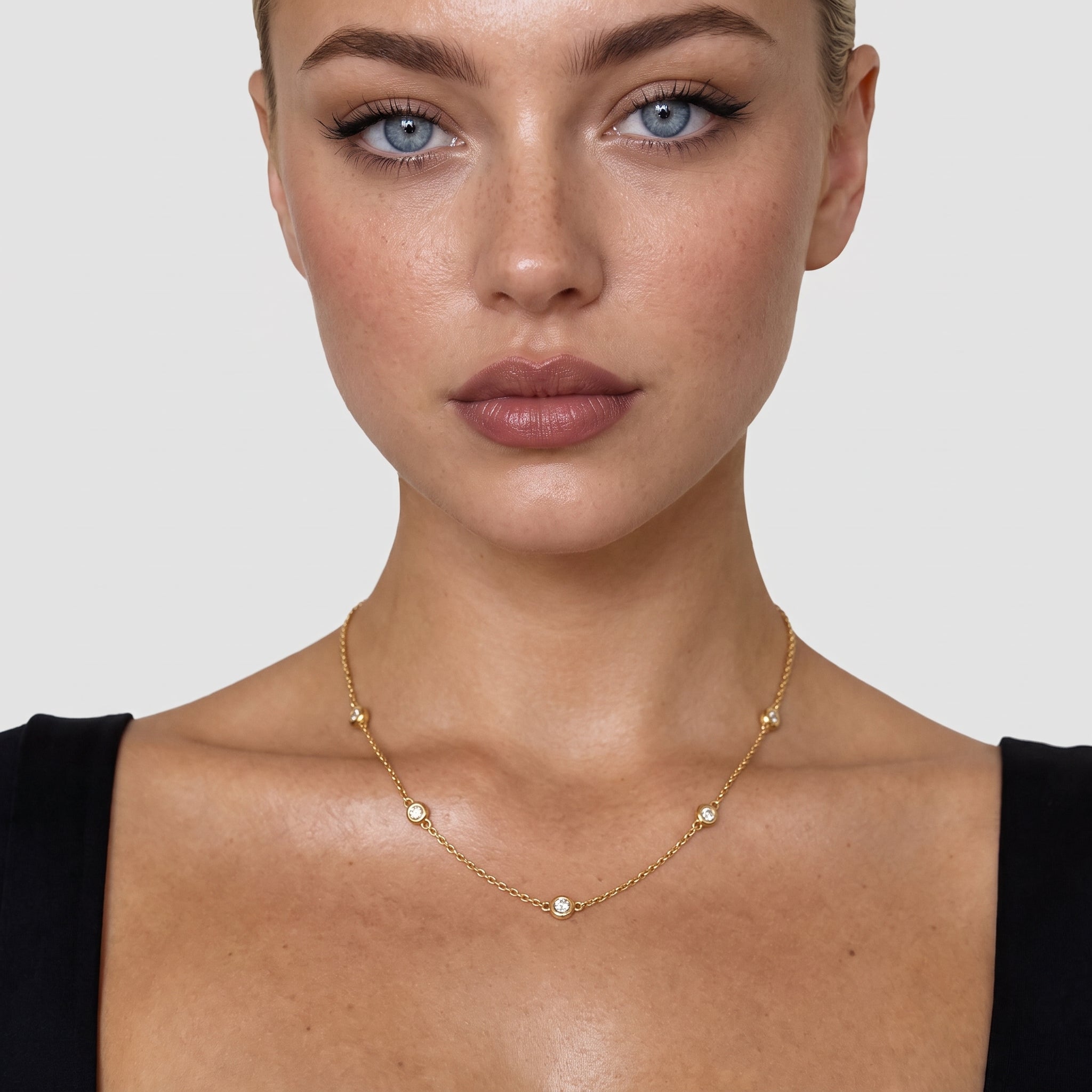 Model wearing the gold-tone crystal necklace