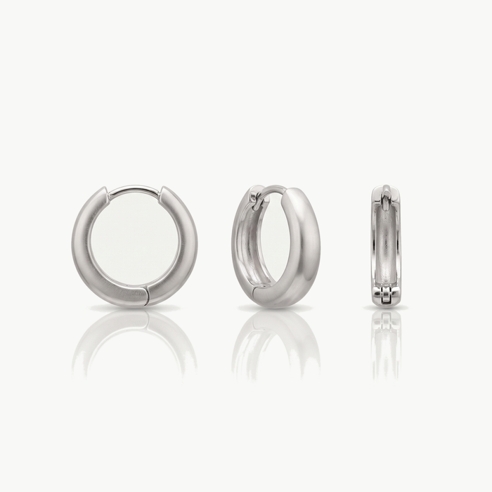 Silver-tone chunky hoop earring shown from the front, at an angle and from the side
