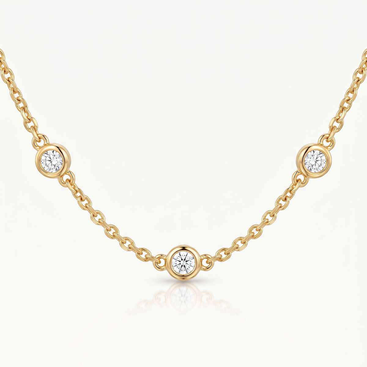 Three crystals on the gold-tone chain, seen at an angle