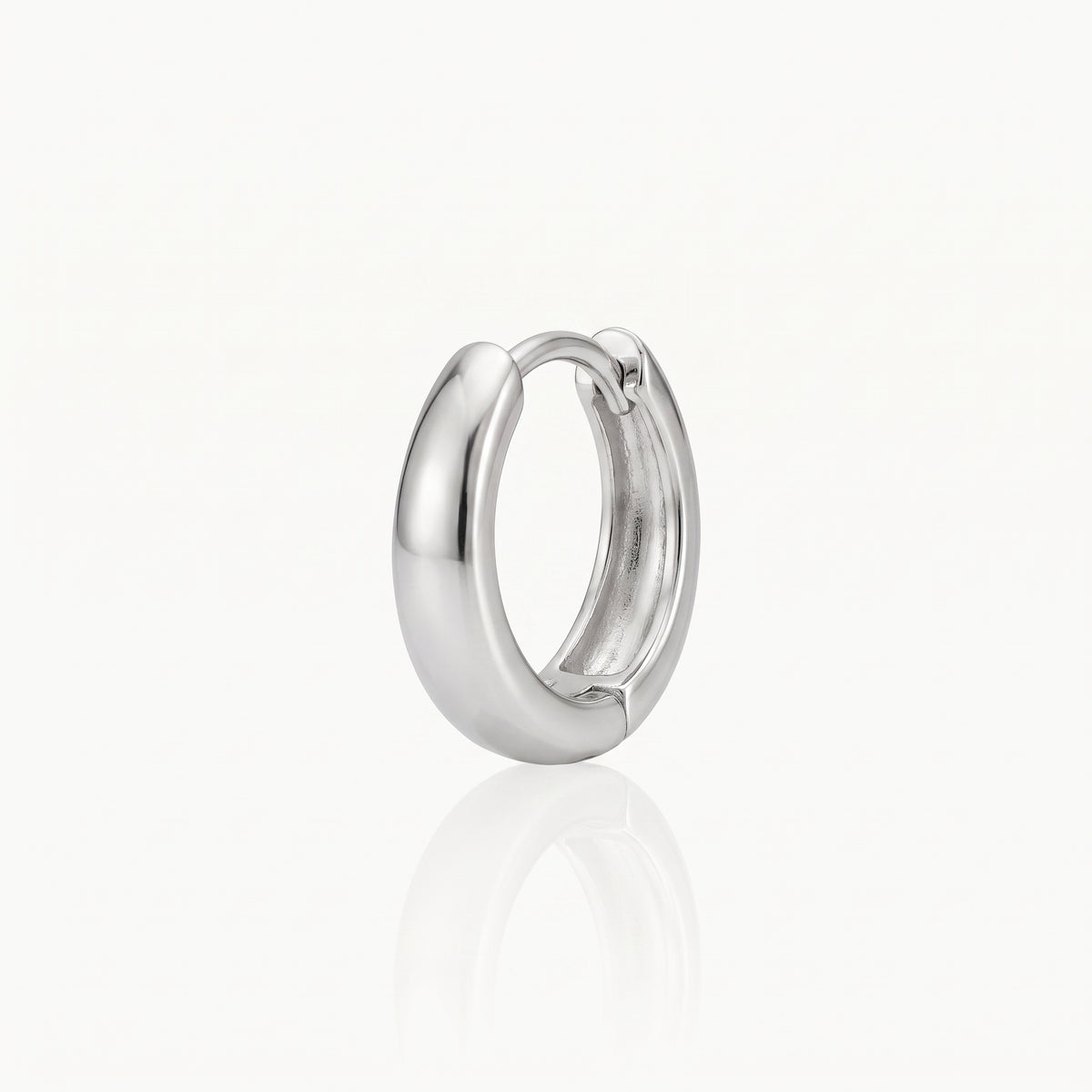 Close-up of a silver-tone chunky hoop earring