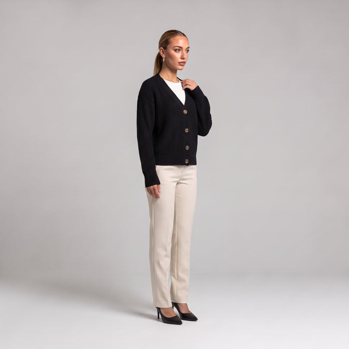 Black chunky knit cardigan, three quarter front view on model