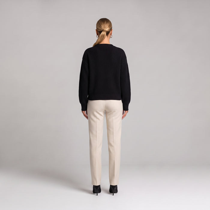 Black chunky knit cardigan, back view on model