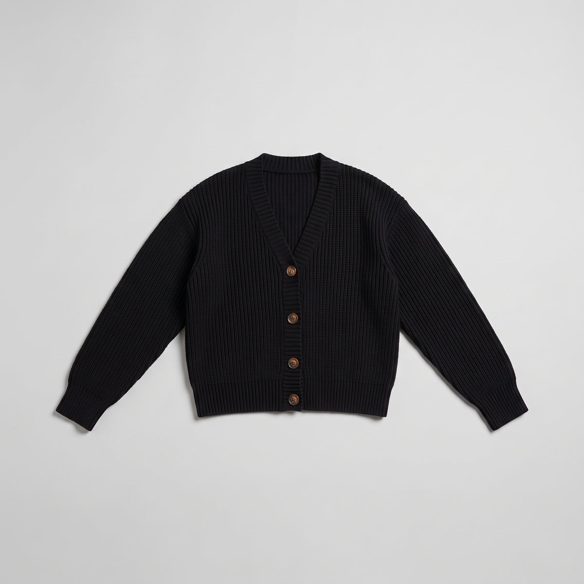 Black chunky knit cardigan laid flat and buttoned, product shot