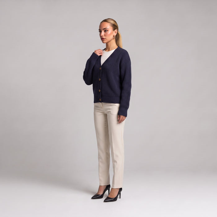 Navy chunky knit cardigan, three quarter front view on model