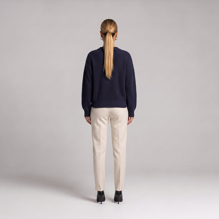 Navy chunky knit cardigan, back view on model