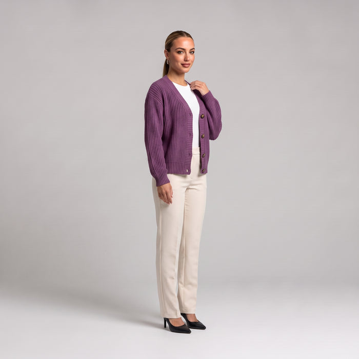 Purple chunky knit cardigan, three quarter front view on model