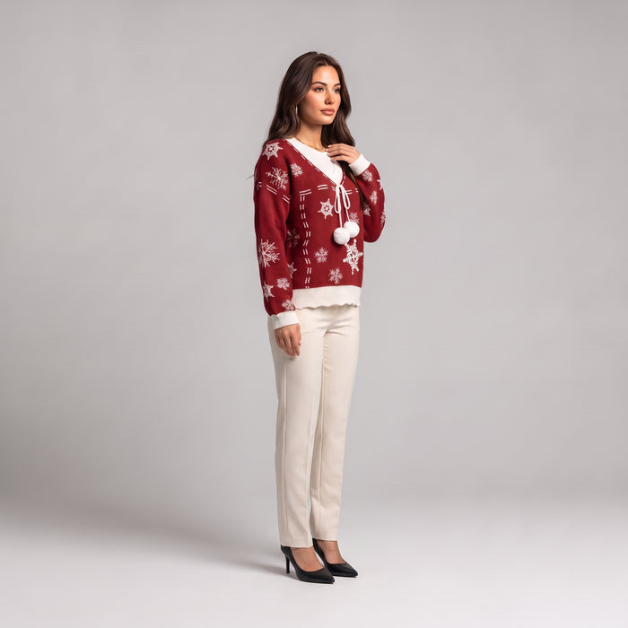 Red Christmas jumper side view, worn with cream trousers
