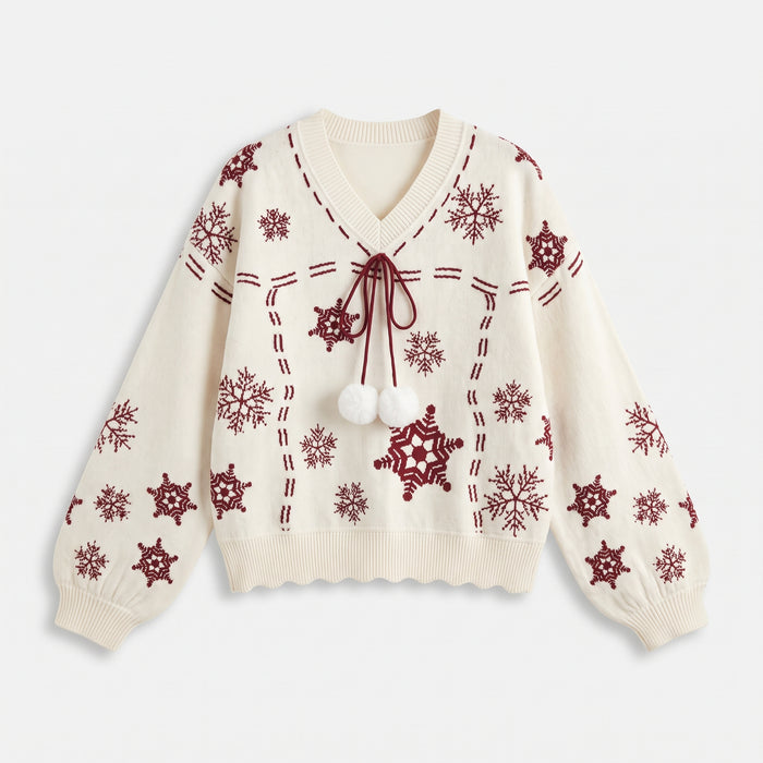 White Christmas jumper laid flat, red snowflake pattern and scalloped hem