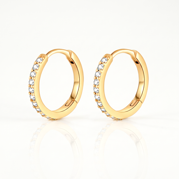 Gold-tone crystal huggie hoop earrings, pair shown from the front