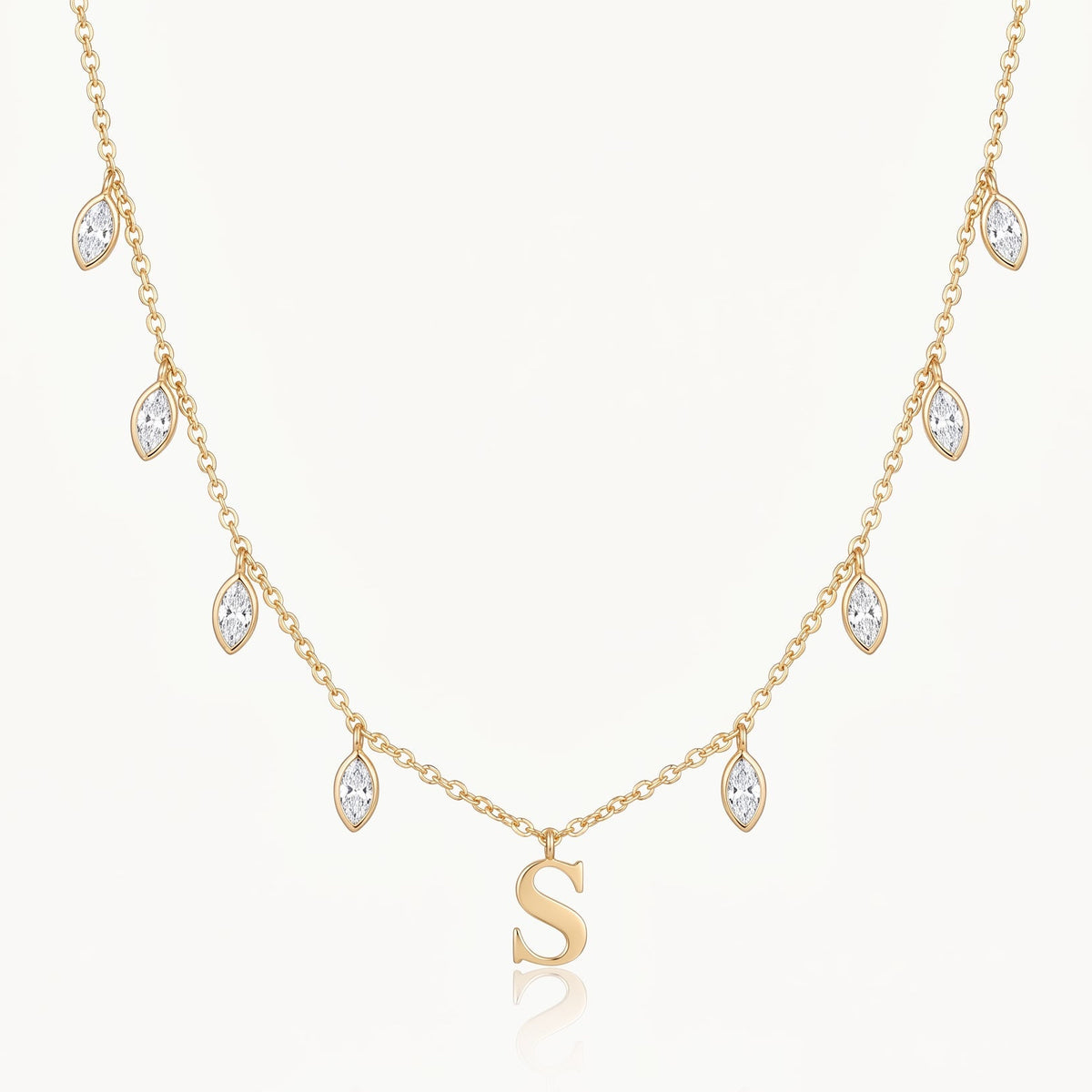 Gold-tone initial necklace with letter pendant and crystal drops