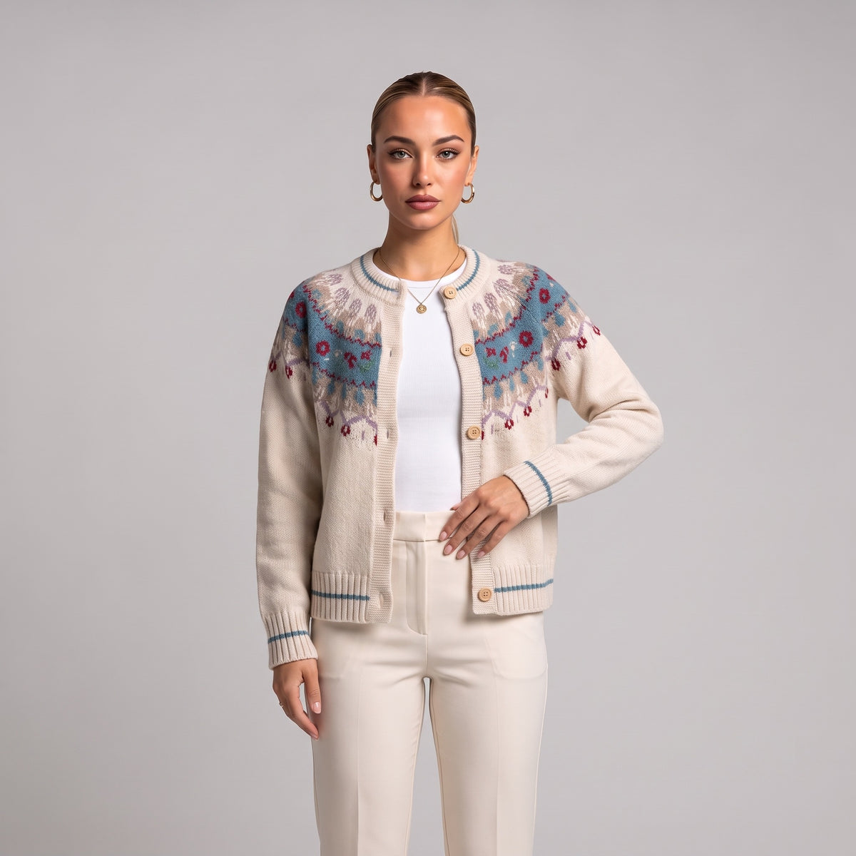 Close-up of white Fair Isle Christmas cardigan on model