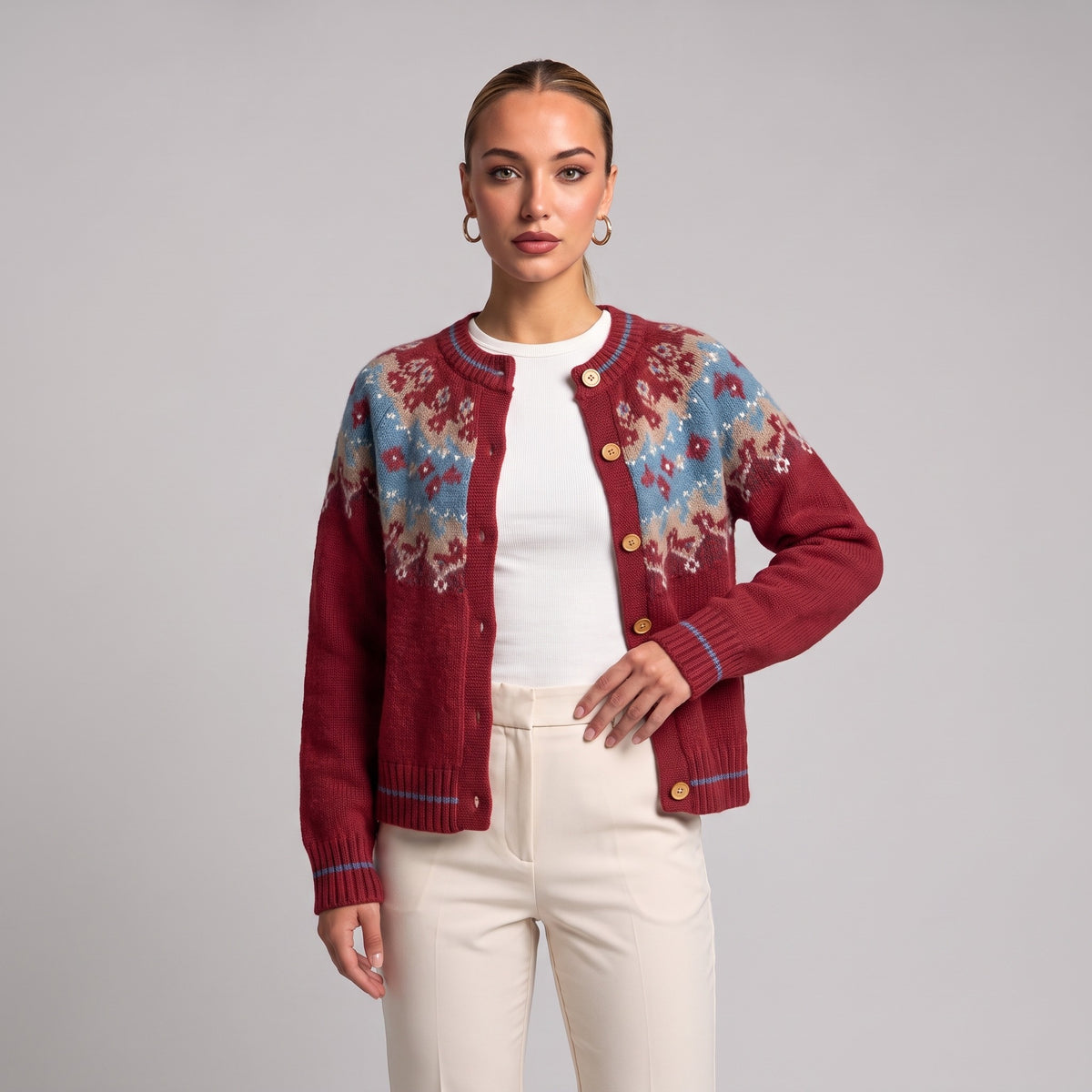 Close-up of red Fair Isle Christmas cardigan on model