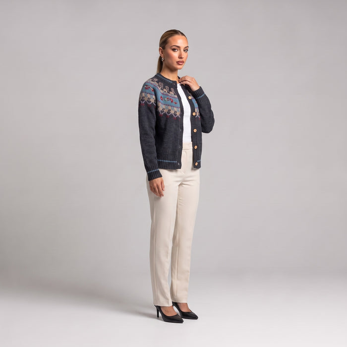 Grey Fair Isle Christmas cardigan, side view worn with cream trousers