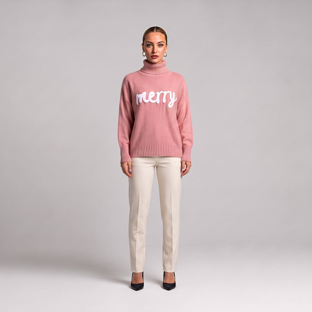 Pink merry roll neck Christmas jumper, front view on model