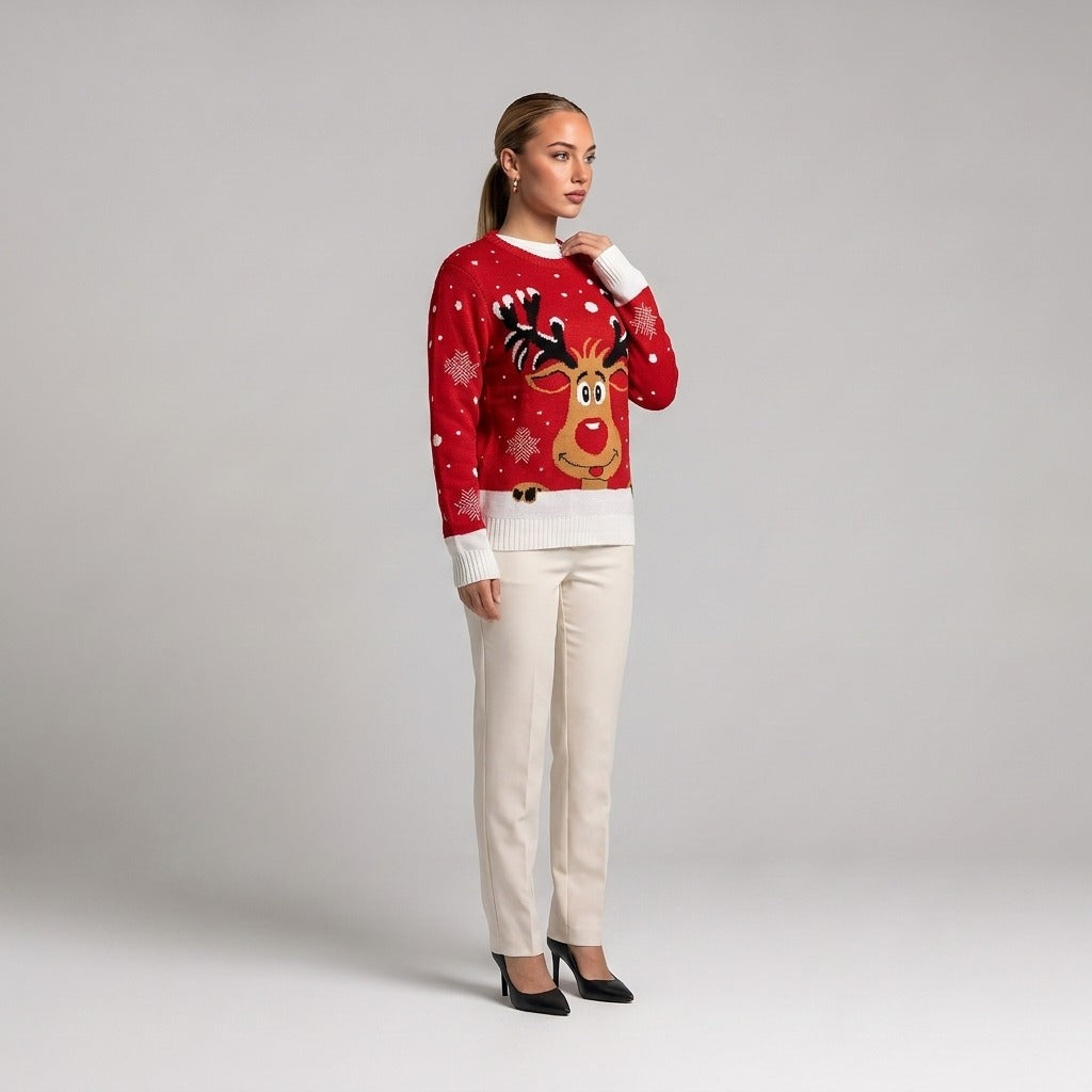 Red reindeer face Christmas jumper, side view worn with cream trousers
