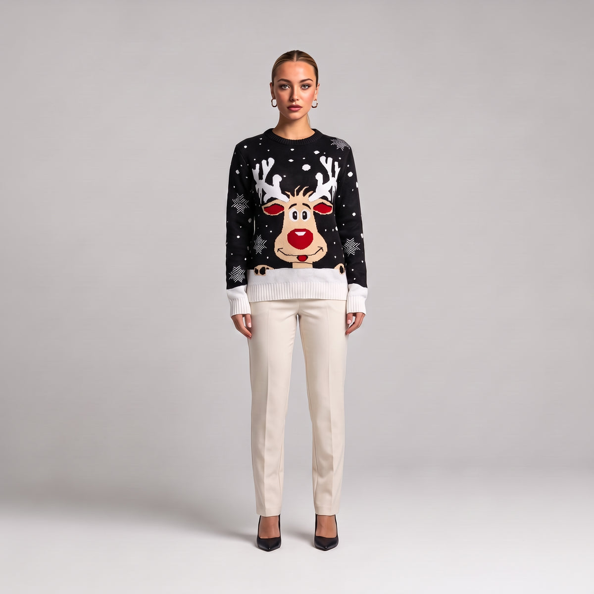 Black reindeer face Christmas jumper, front view on model
