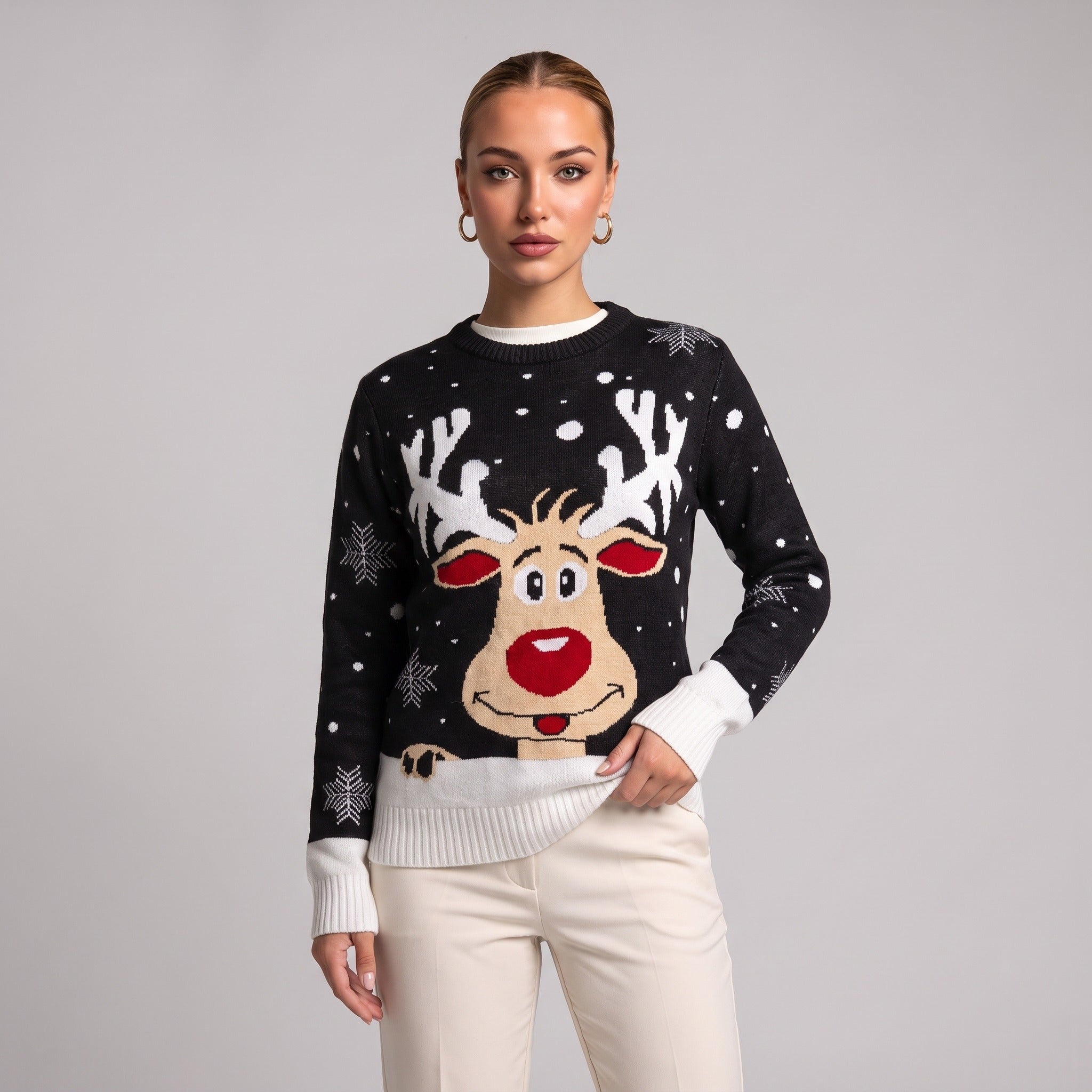 Close-up of black reindeer face Christmas jumper on model