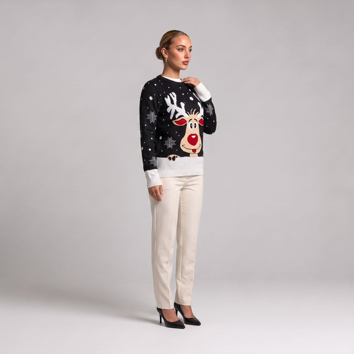 Black reindeer face Christmas jumper, side view worn with cream trousers