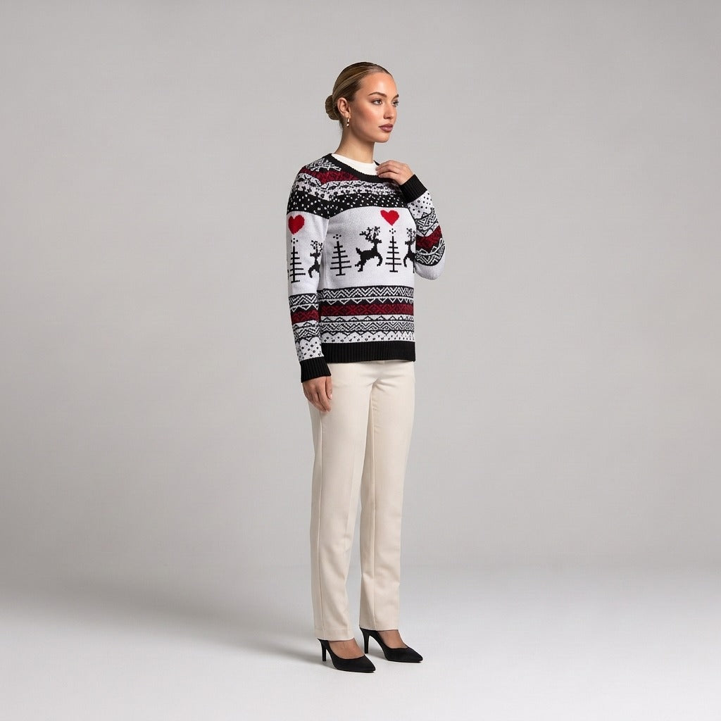 White Fair Isle Christmas jumper with hearts and reindeer, side view worn with cream trousers