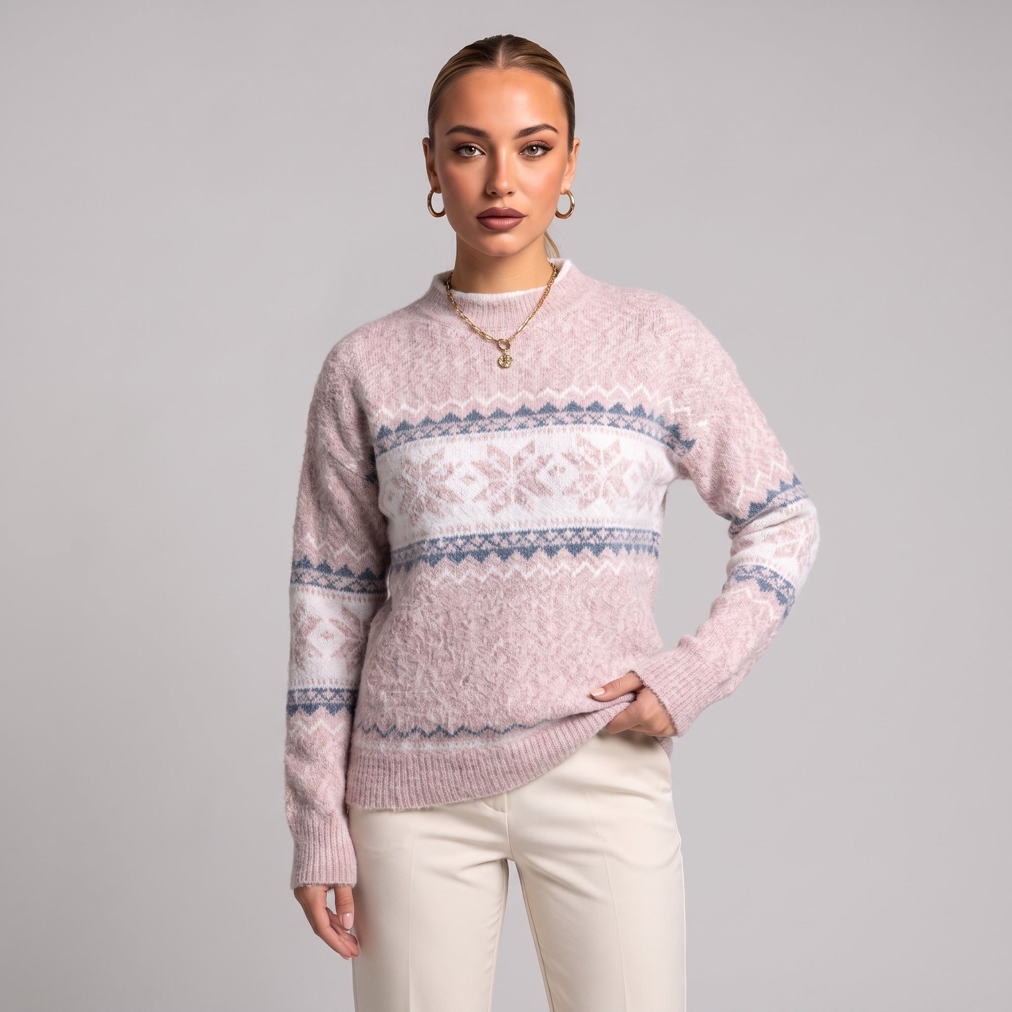 Close-up of baby pink snowflake chenille Christmas jumper on model