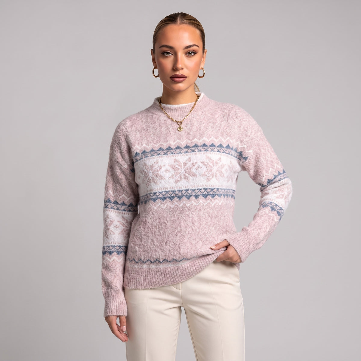 Close-up of baby pink snowflake chenille Christmas jumper on model