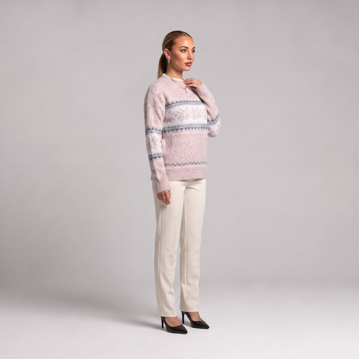 Baby pink snowflake chenille Christmas jumper, side view worn with cream trousers