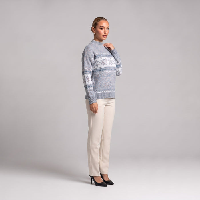 Grey snowflake chenille Christmas jumper, side view worn with cream trousers