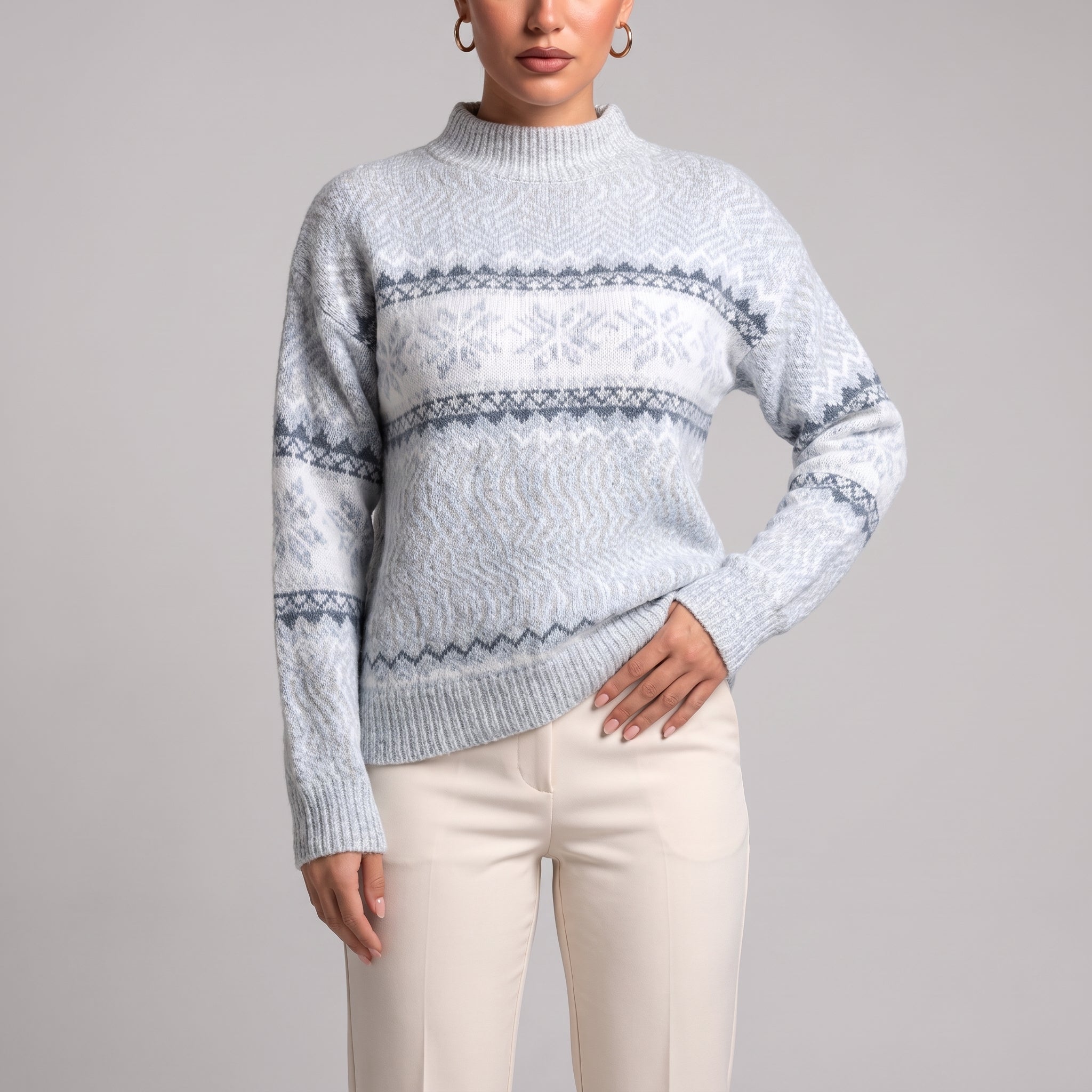 Close-up of baby blue snowflake chenille Christmas jumper on model