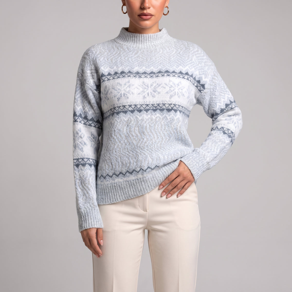 Close-up of baby blue snowflake chenille Christmas jumper on model