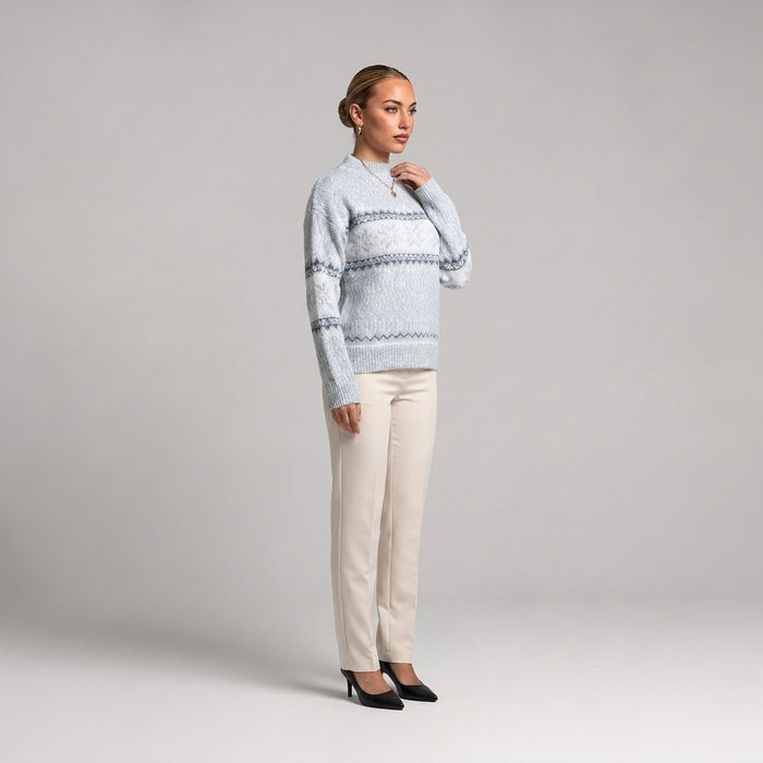 Baby blue snowflake chenille Christmas jumper, side view worn with cream trousers