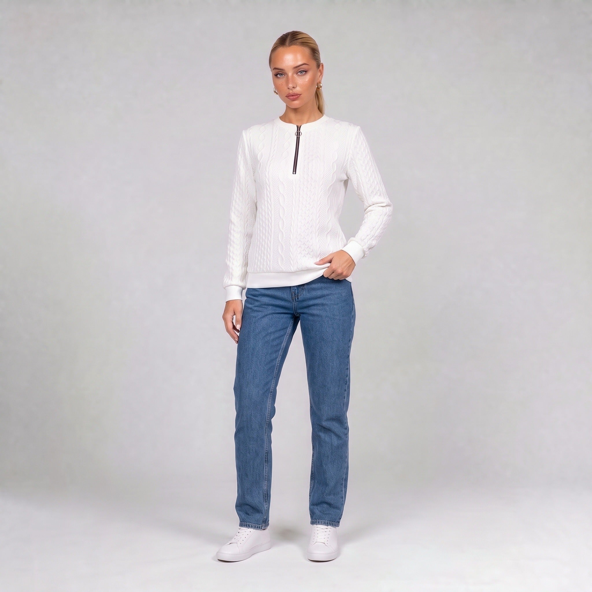 White quarter zip cable knit jumper, front view on model