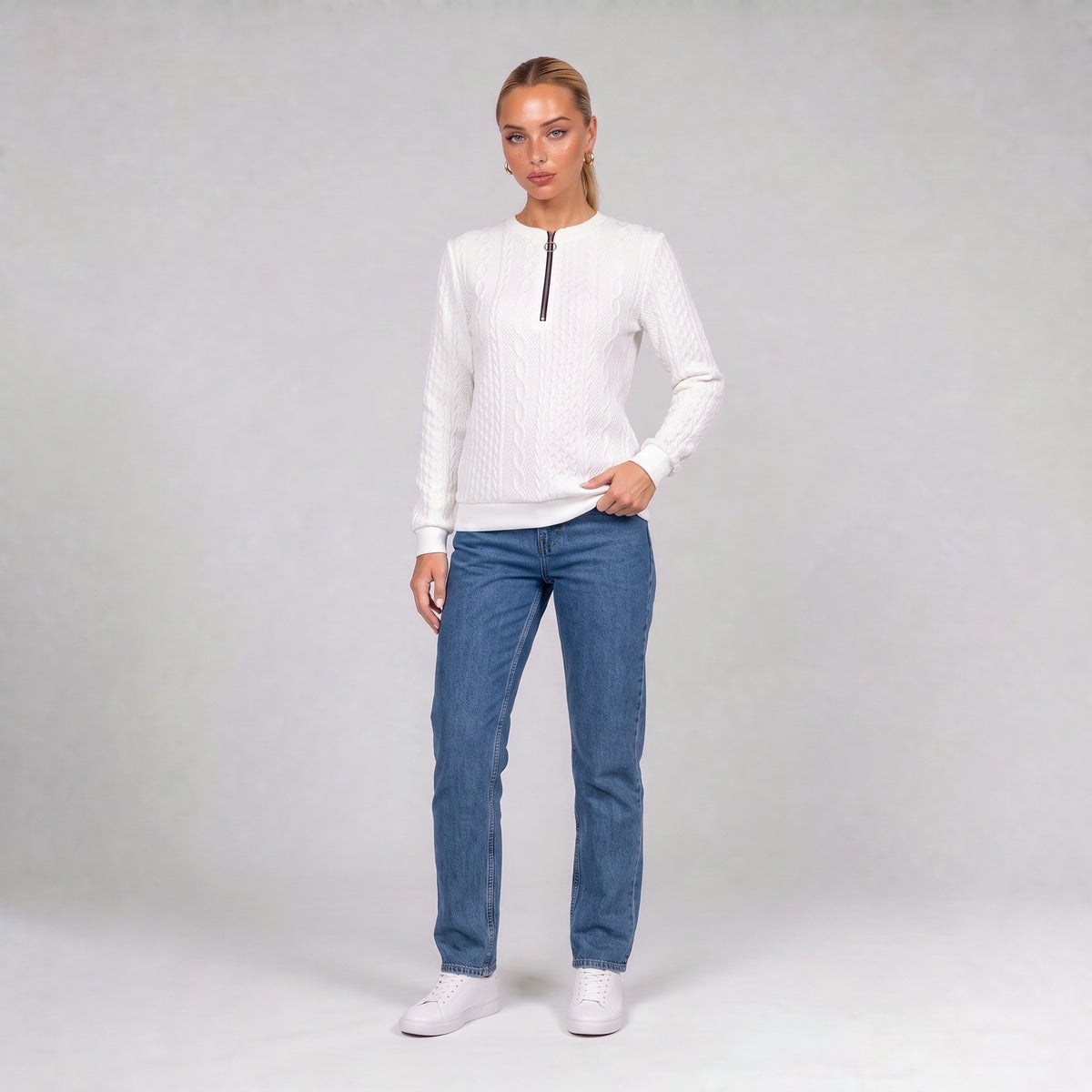 White quarter zip cable knit jumper, front view on model