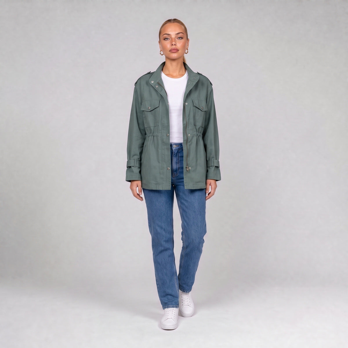 Green utility jacket, front view on model with jeans