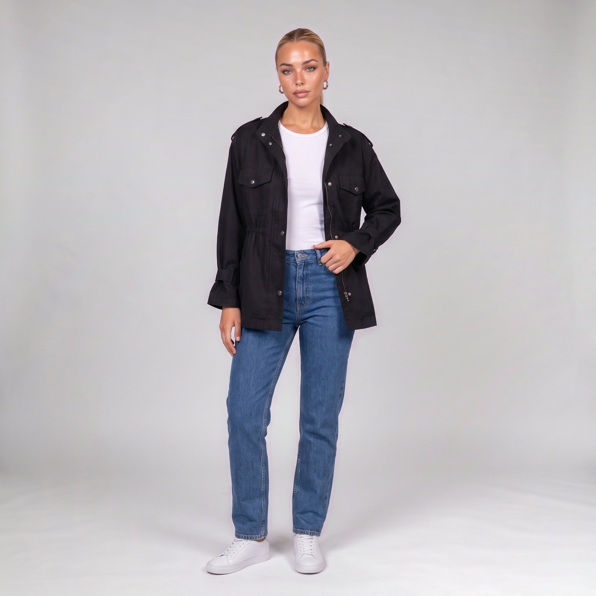 Black utility jacket, front view on model with jeans