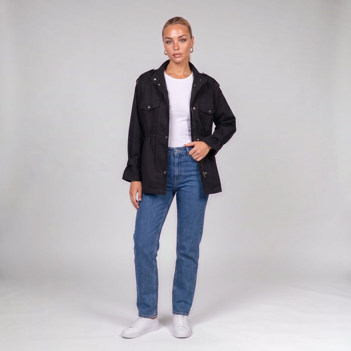 Black utility jacket, front view on model with jeans