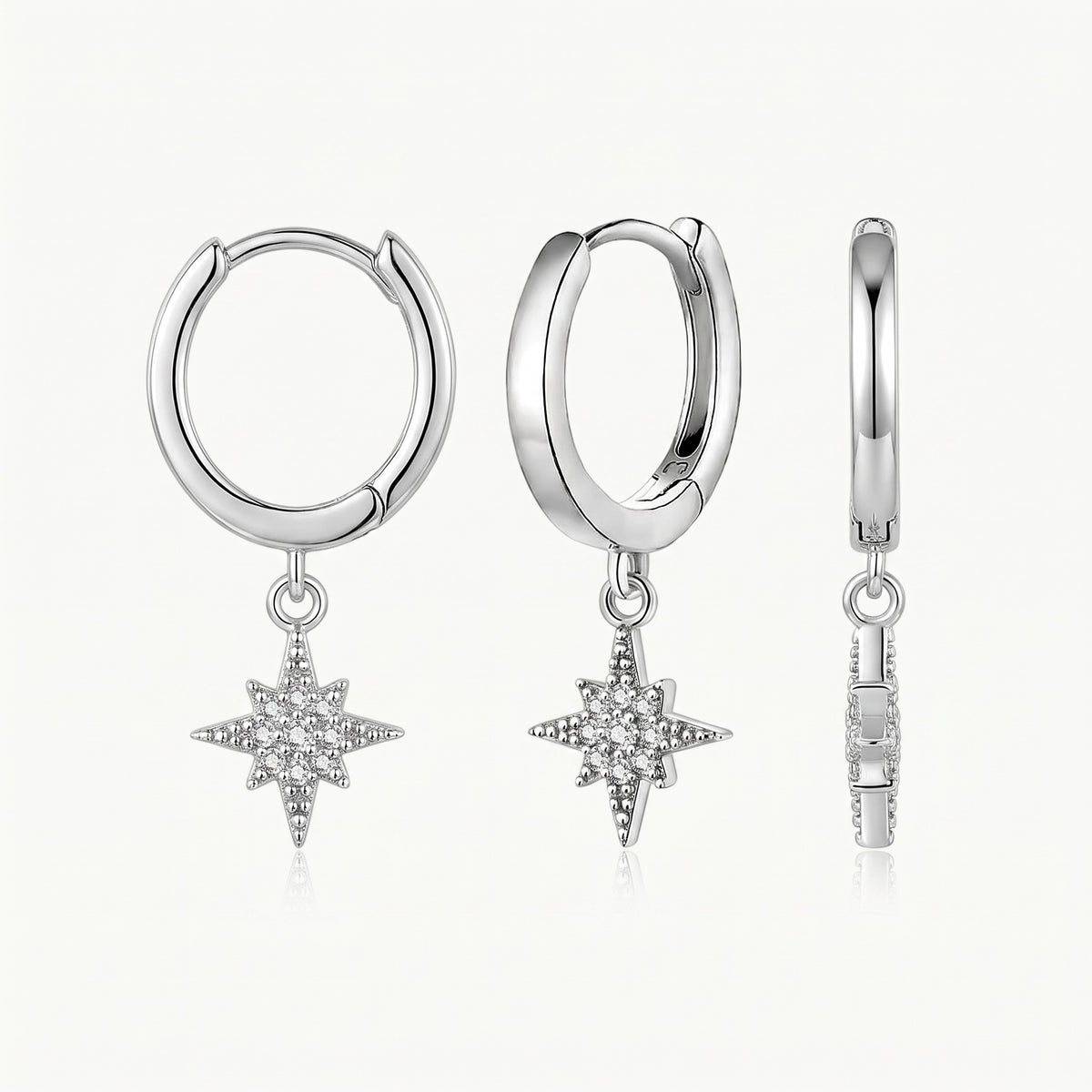 Silver-tone huggie earring with charm, shown from three angles