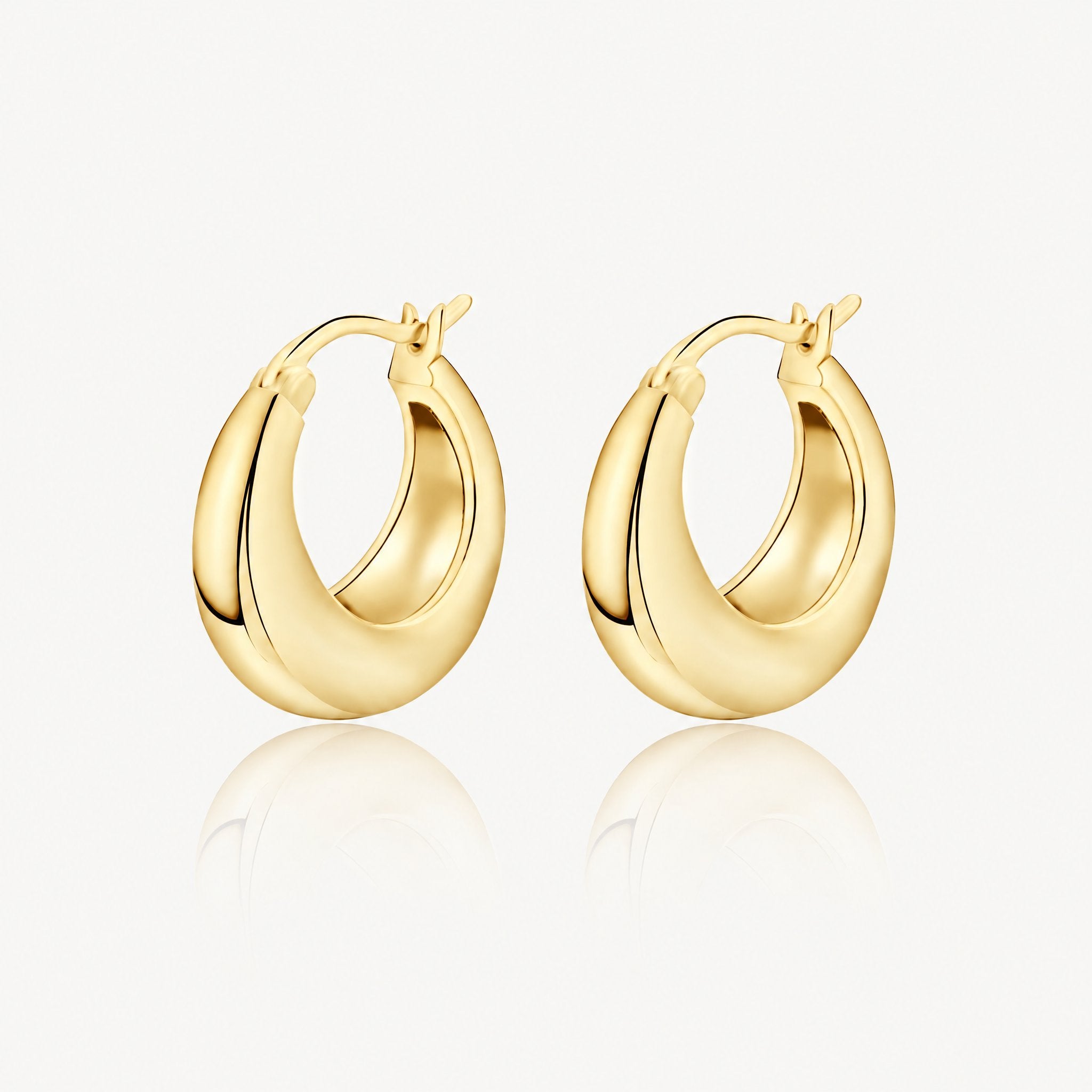 Gold-tone chunky tapered hoop earrings, pair shown from the front