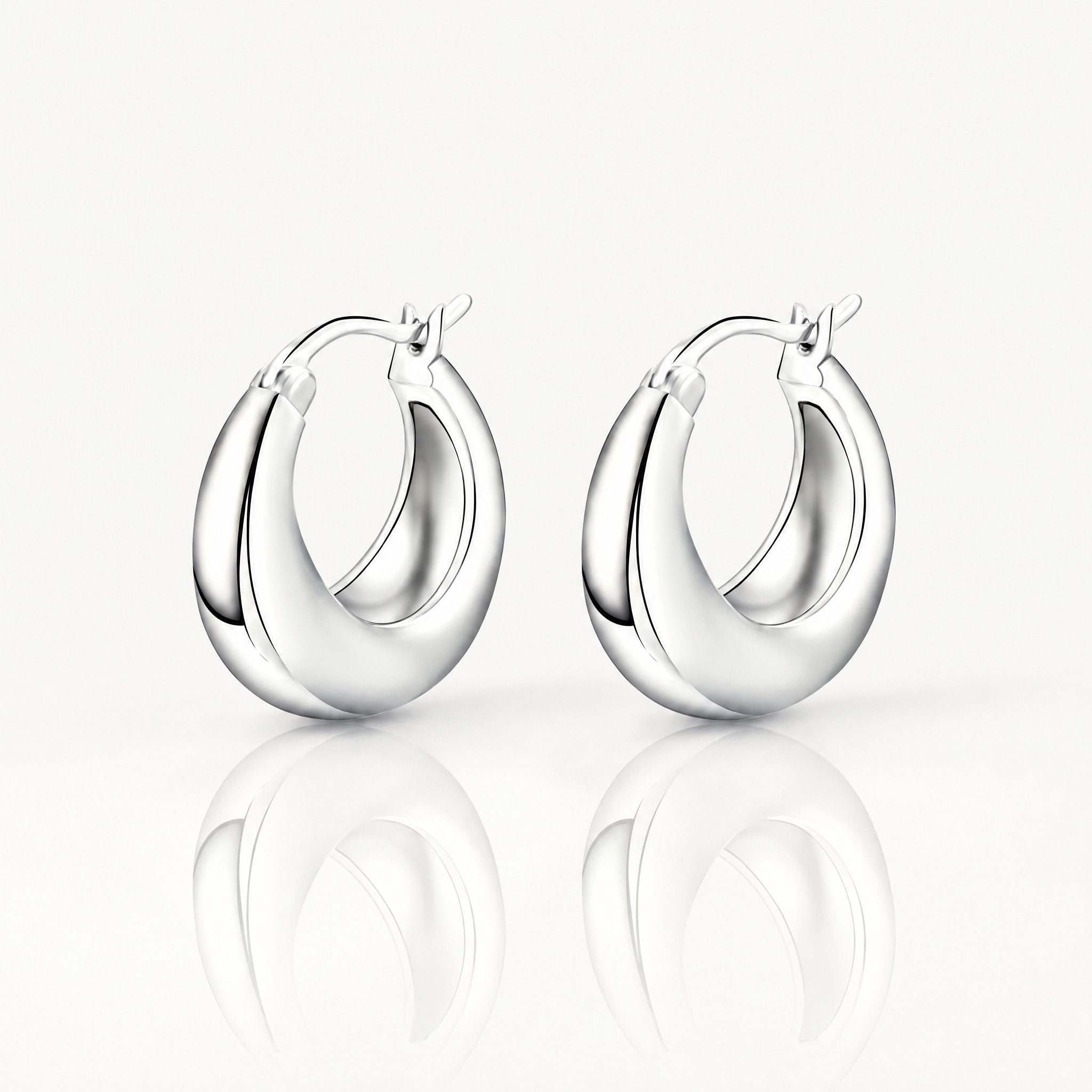 Silver-tone chunky tapered hoop earrings, pair shown from the front