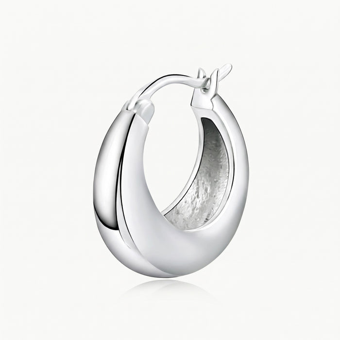 Close-up of the silver-tone chunky hoop and hinged closure