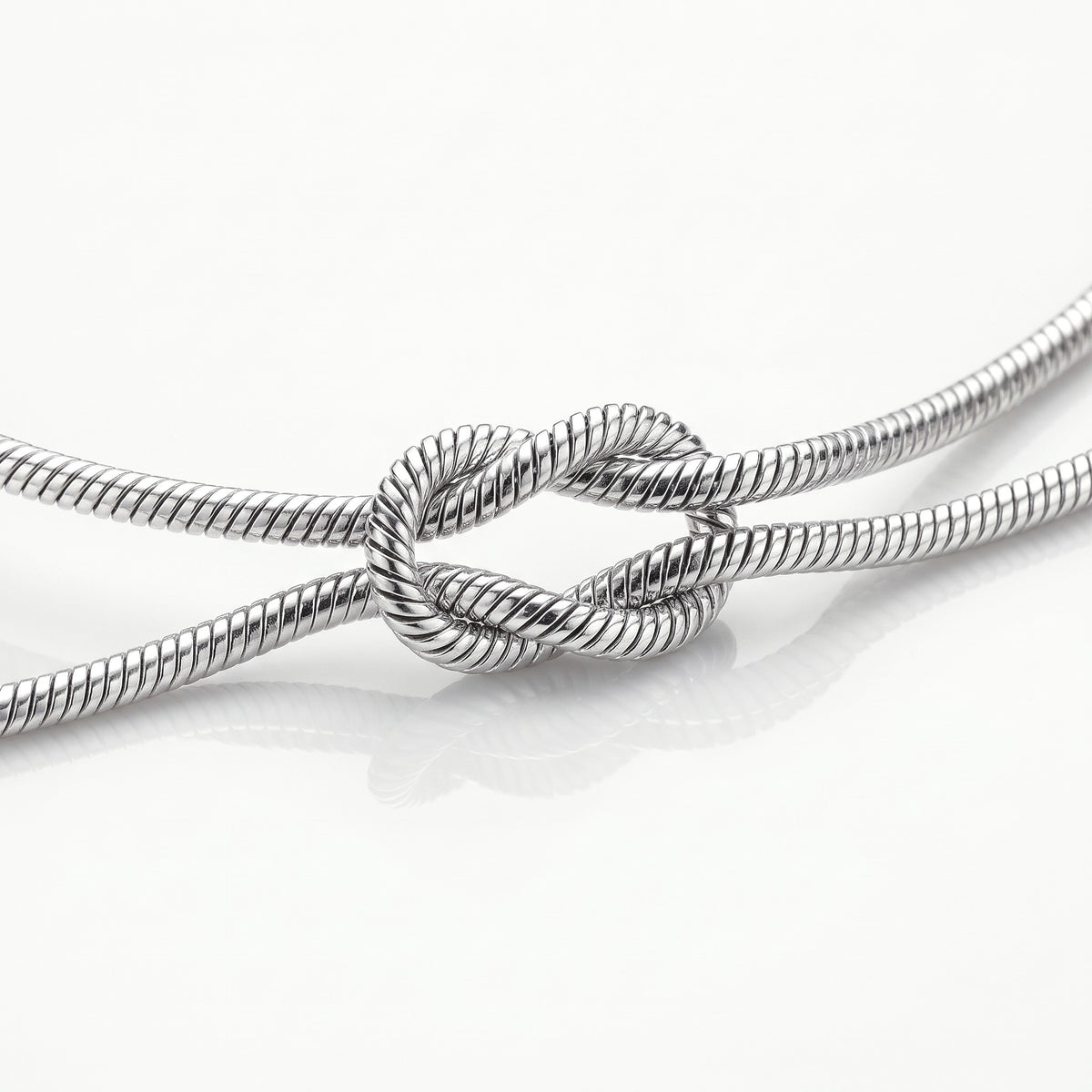Close-up of the knot in the silver-tone snake chain