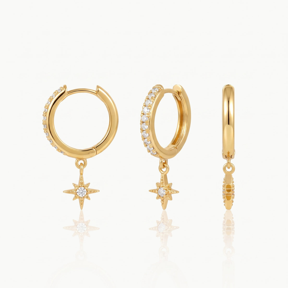 Gold-tone star charm huggie hoop earrings, front and side view