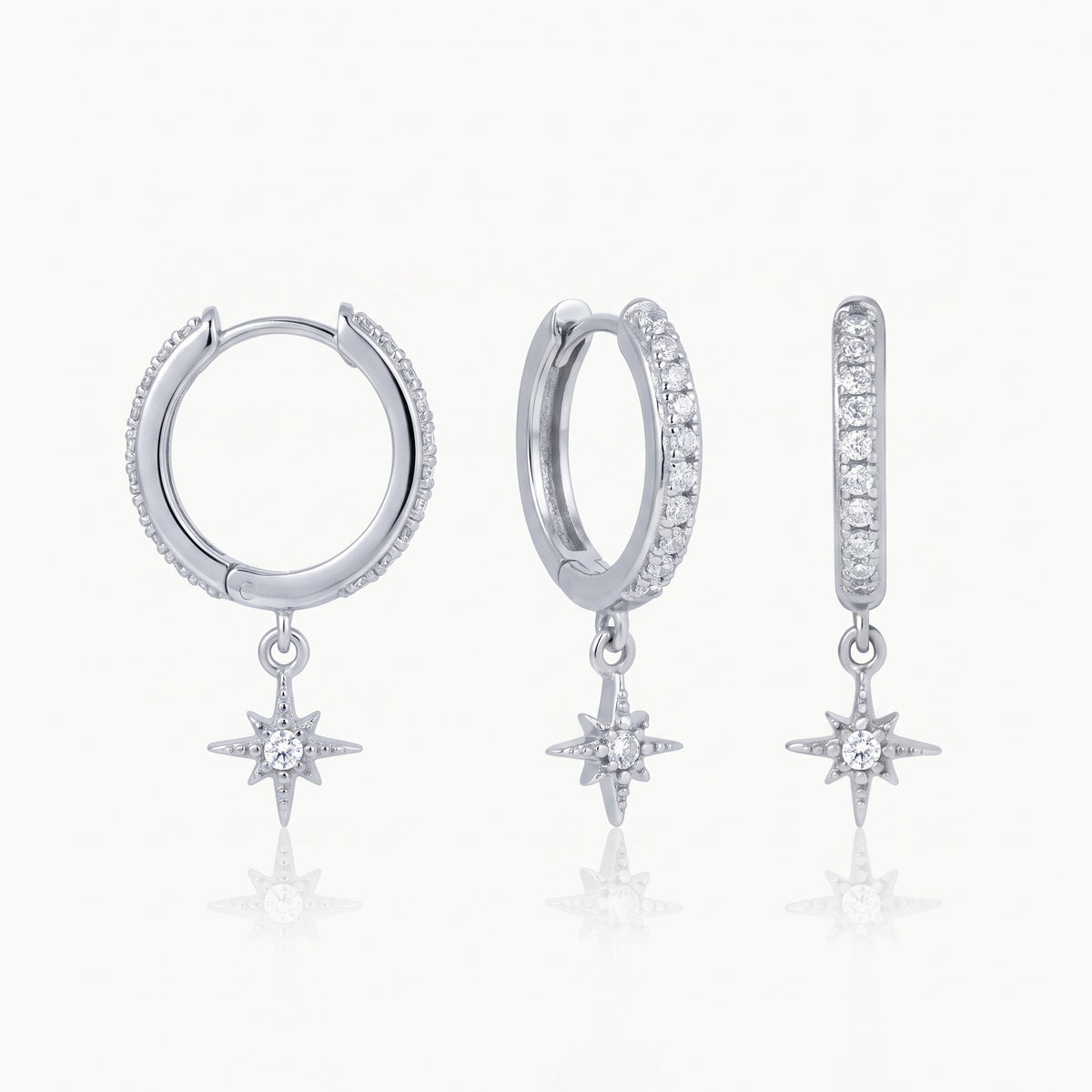 Silver-tone star charm huggie hoop earrings, front and side view