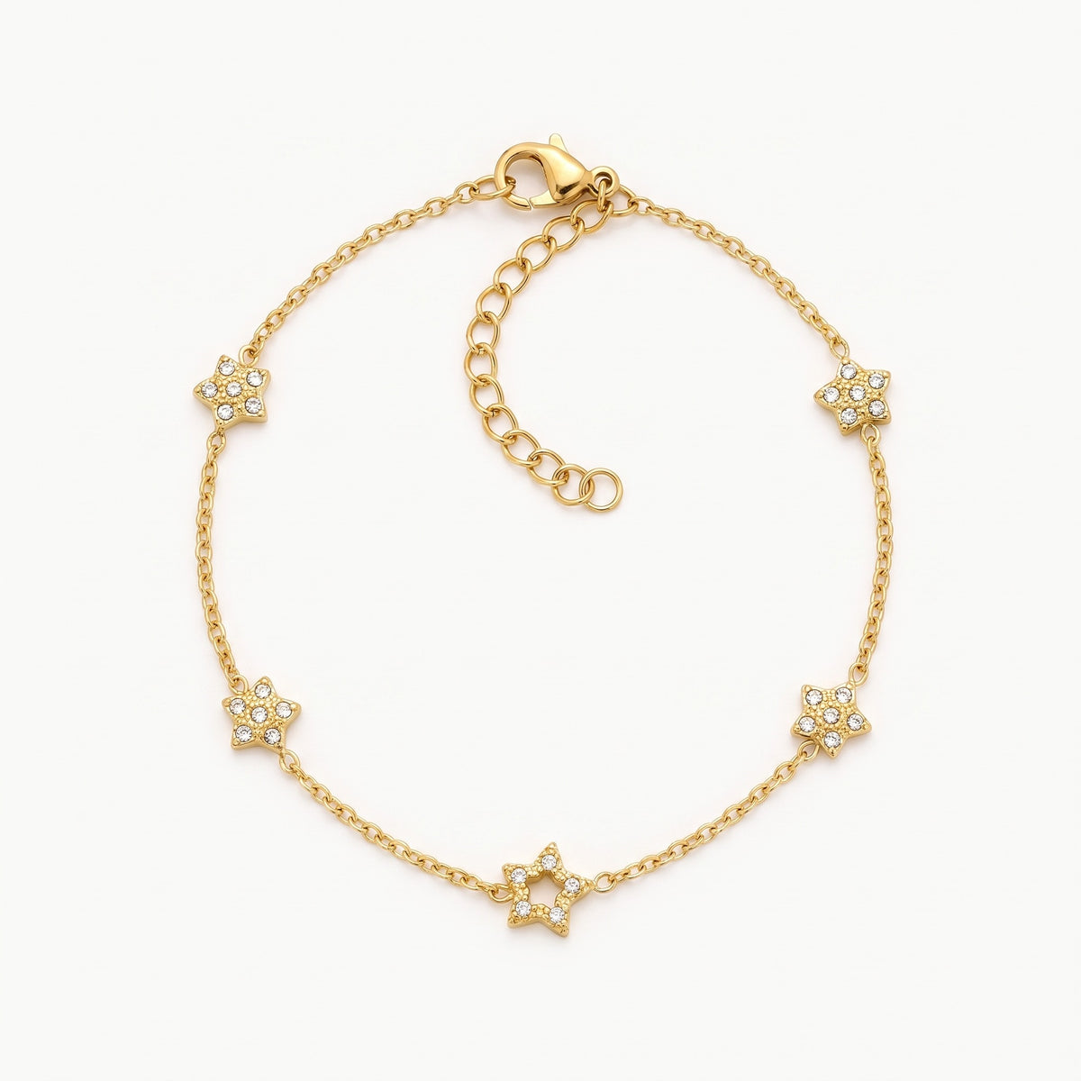 Gold-tone star charm bracelet with crystal stars, laid out flat