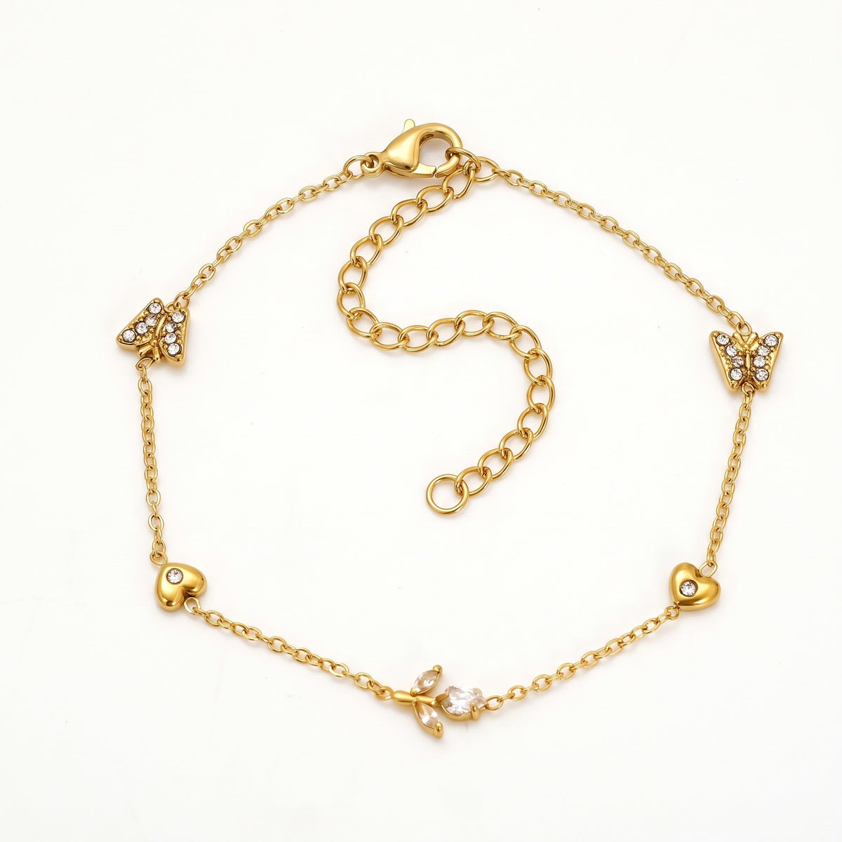 Gold-tone butterfly and heart charm bracelet, laid out flat