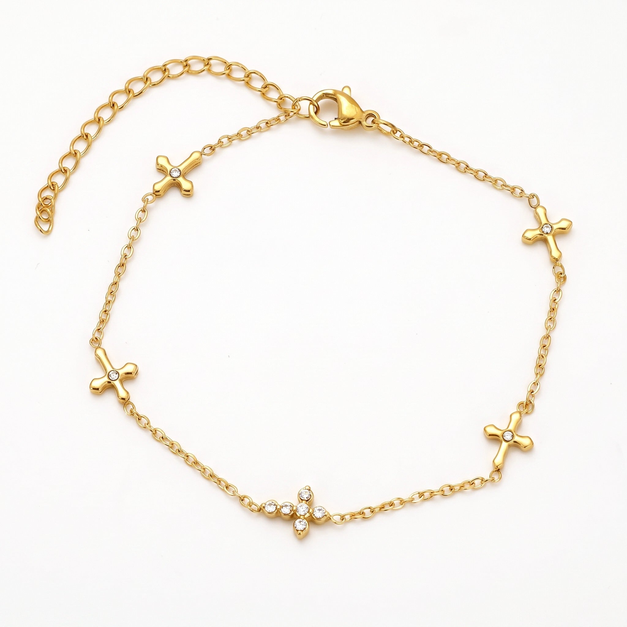 Gold-tone cross charm bracelet with crystals