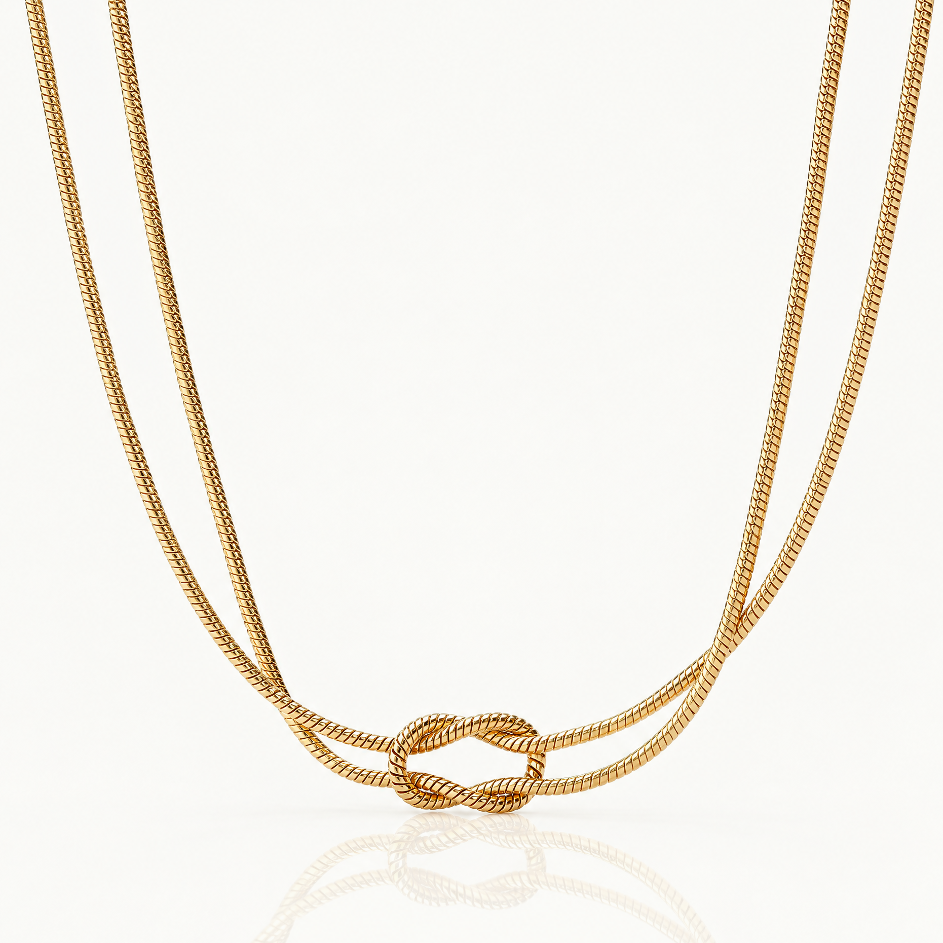 Gold-tone knot necklace with a double snake chain
